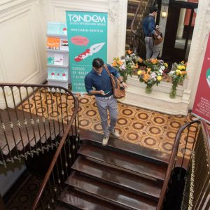 TANDEM Madrid, stairs with banners and student